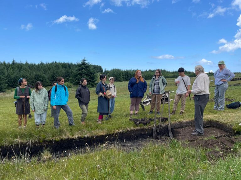 A group learning together in the Burren landscape