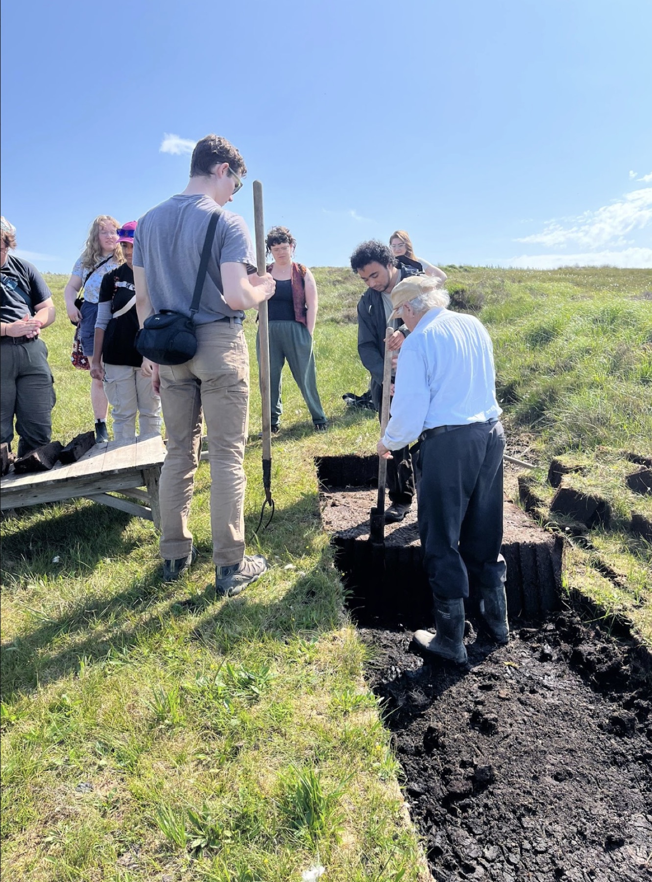 A group learning together during peatland fieldwork