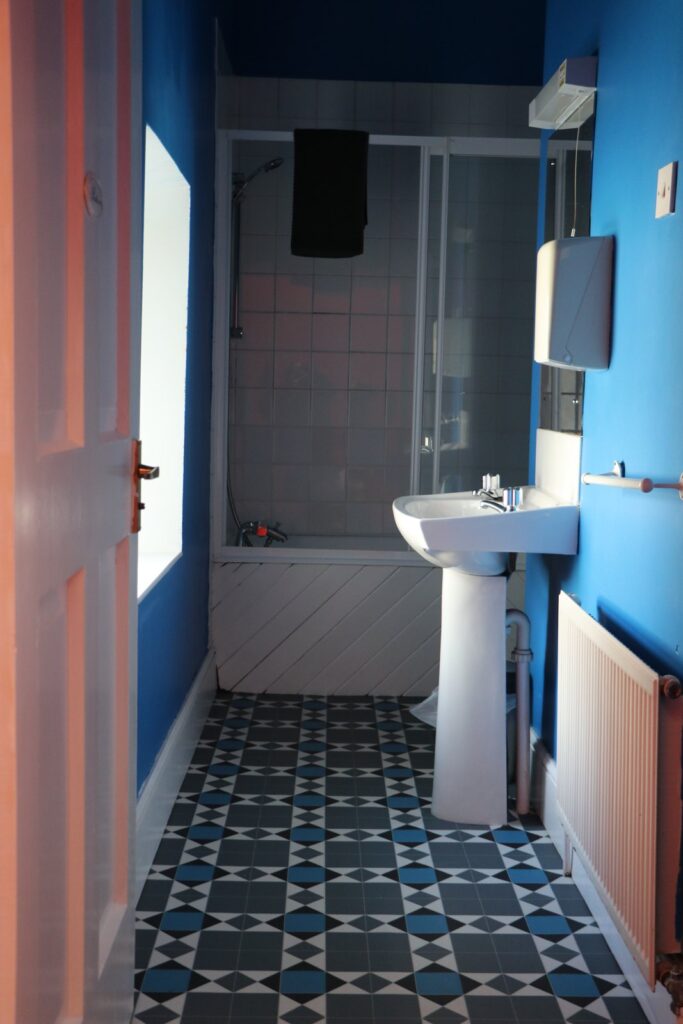 Bathroom with a bath and washbasin in Newtown House