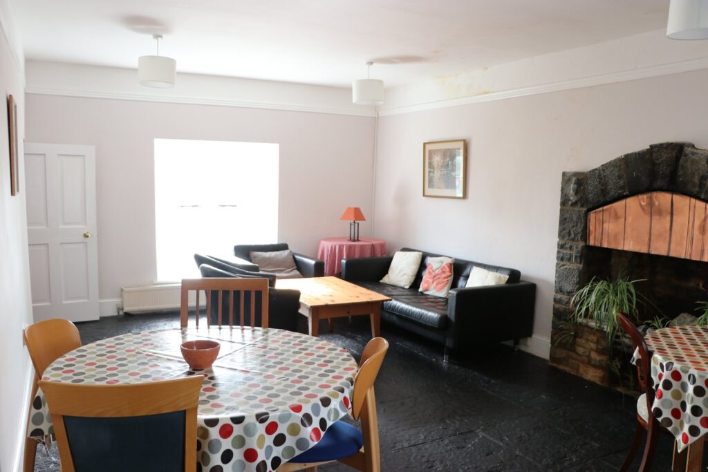 Shared dining table and sitting area in Newtown House