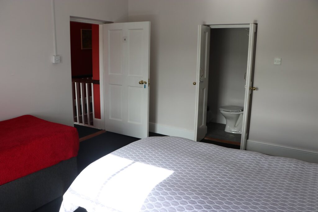 Bedroom and adjoining bathroom in Newtown House